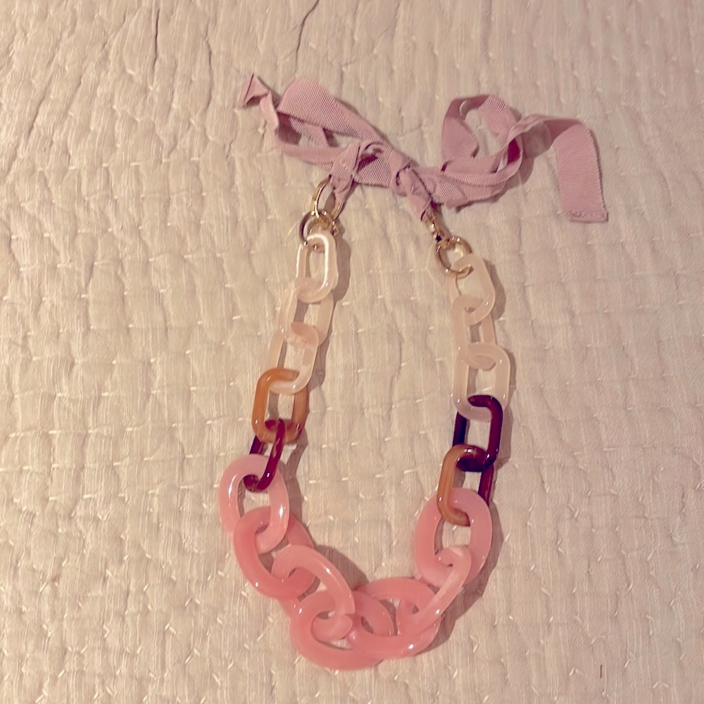 Beautiful acetate oversized necklace with ribbon tie trim